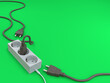 © Zulfikar - Electric socket with three plugs, one plug has been plugged in the electric socket and isolated on a green background