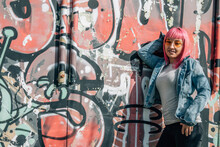 Pink Hair Urban Young Woman Leaning On Wall
