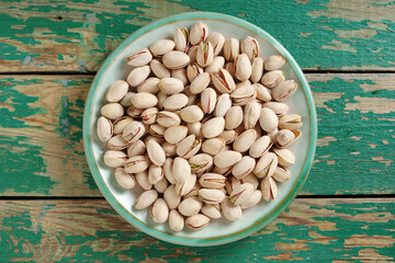 Wall Mural - Salted pistachios in plate