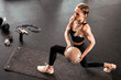 © ty - Fit and muscular woman exercising with medicine ball at gym.