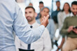 © Matthew Cerff/peopleimages.com - Speaker, hands and presentation for employees with close up for a meeting at conference room. Seminar, training and hand for discussion with corporate team for learning about business or career.
