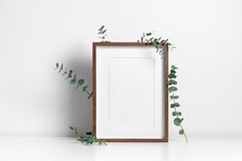Portrait Picture Frame Mockup In White Minimalistic Interior With Eucalyptus Plant Decoration, Blank Frame With Copy Space