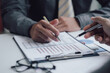 © Kritdanai - Business people talking about business strategy Collaborate teamwork during discussions on financial and marketing documents, financial data analysis meetings, and in-office charts.