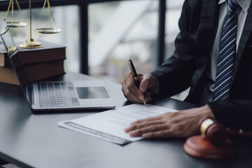 Lawyer man holding pen with contract or agreement document to the customer for signing in courtroom legal, Sign a contract business.