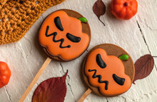 Two Halloween Cookies Close-up On A Light Wooden Background. Top View.