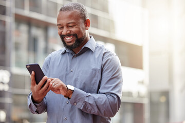 Canvas Print - Phone, text message a senior business black man in the city, typing an email while commuting to work. Mobile, contact and social media with a happy mature male employee networking in an urban town