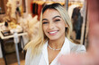 © Beaunitta Van Wyk/peopleimages.com - Woman, portrait and selfie with smartphone with shop in closeup for happiness. Female person, face and selfies at a store with a smile for a sale with beauty to share online with digital app.