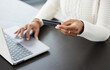 © Michael Cunningham/peopleimages.com - Woman, hands and laptop with credit card for online shopping, payment or finance on office desk. Hand of female person or shopper on computer for banking app, purchase or ecommerce at the workplace