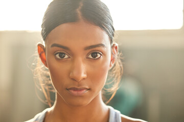 Wall Mural - Fitness, portrait or Indian woman at gym for a workout, exercise or training for health or wellness. Face of sports girl or serious female athlete with strong mindset, resilience or focus in studio