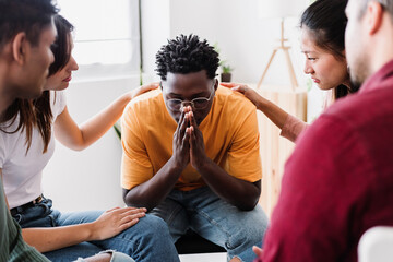 Group of people sitting in circle talking and supporting on therapy meeting at community center. Mental health and help concept.