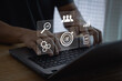 © THAWEERAT - Target customer, targeting the business concept, Businessman use laptop with digital marketing icons on virtual screen, Business goal, Digital marketing, online business, Set goals for better results.