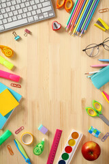 Wall Mural - Frame of school supplies on wooden desk table. Back to school, education concept