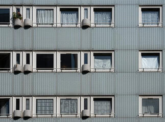 Wall Mural - Paris, France - 06 03 2023: View of the facade of a blue apartment building.