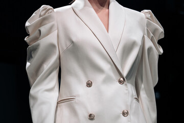 Sticker - Classy white jacket with buttons on female body. Fashion fancy details. Style, design of women's clothing and accessories.