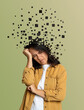 © New Africa - Thoughtful woman with flying pixels from her head symbolizing amnesia on olive background