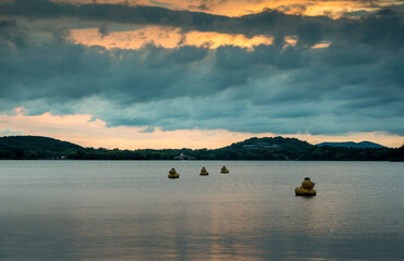 Canvas Print - Some decorative ducks in the lake at sunset