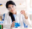 © Elnur - Female chemist working at the lab