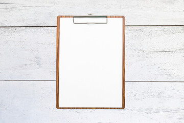 Wall Mural - Blank wooden clipboard on old white wooden background, blank white paper on wooden clipboard