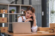 © wichayada - Small Business, Startup SME, Owner Entrepreneurs. Asian woman with unsuccess business online shopping crying and serious face unhappy mood.