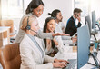 © Beaunitta Van Wyk/peopleimages.com - Call center, training and group of women at computer in discussion at help desk with advice from team leader. Learning, planning and help, black woman mentor coaching staff in customer service agency