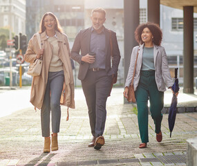 Canvas Print - Business people in city, walking and travel with commute to work, happy corporate group with journey and outdoor. Professional, businessman and women walk in street with employees traveling together