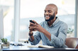 © Graham Fielies/peopleimages.com - Black man in office, check social media on smartphone and smile at meme, lunch break and communication. Male employee at workplace, using phone and technology, mobile app and contact with chat