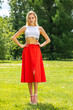 © Andrey_Arkusha - Portrait of a young beautiful blonde woman in a long red skirt