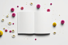 Top View At Open White Notebook With Flowers Scattered On Table. Flat Lay. Copy Space And Mock Up. Ai Generation. Concept Of Greeting Card And Advertising.