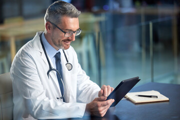 Healthcare, doctor and man with a tablet, typing and connection with online reading, innovation and internet. Male person, employee and medical physician with technology, website info or professional