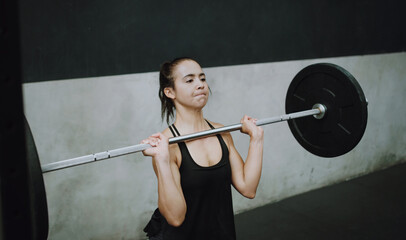 Wall Mural - Weightlifting, fitness and woman lifting barbell in gym for training, exercise and intense workout. Deadlift, strong muscle and female body builder lift weights for challenge, wellness and strength