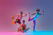 © master1305 - Funny, creative image of young men in stylish colorful sportswear training against gradient blue pink studio background in neon light. Concept of sportive and active lifestyle, humor, retro style. Ad