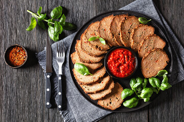 Wall Mural - italian meatloaf cut in slices on black plate