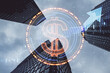 Creative digital round dollar sign and forex chart on blurry city skyline background. Online banking, cryptocurrency and finance concept. Double exposure.