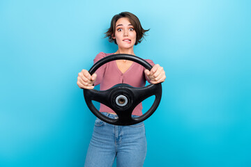 Sticker - Photo of impressed speechless woman bob hairstyle dressed pink cardigan biting lips hold steering wheel isolated on teal color background