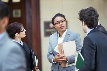 Wall Mural - Lawyers talking outside courtroom