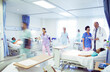 © KOTO - Doctors and nurses making rounds in hospital room