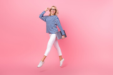 Sticker - Full length photo of sweet pretty woman dressed striped shirt eyewear jumping holding device isolated pink color background