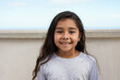 © Sabrina - Happy latin female child smiling on camera outdoor - Childhood and carefree concept