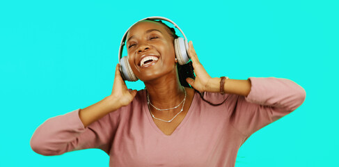 Canvas Print - Dance, music and headphones with black woman in studio for freedom, streaming and online radio. Happiness, technology and relax with girl dancing to track, songs and audio isolated on background