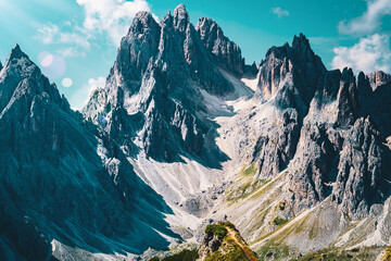 Wall Mural - Athletic woman walks on super epic view point with Cadini group in the morning. Tre Cime, Dolomites, South Tirol, Italy, Europe.