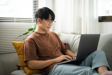 Man work from home. work online on laptop. Asian businessman working online business concept with social distancing laptop online meeting.