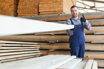 Wall Mural - Carpenter in uniform check boards on sawmill