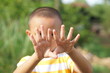© buraratn - Asian boy looks at his hands after washing with water