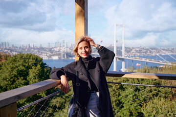 Wall Mural - Enjoying vacation in Istanbul. Young traveling woman is on view point