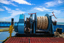 Mooring Winch On A Forward Of A Ferry With Rope And Chain In Drum. Mechanical Device Equipment For Ship Mooring In Port. Anchor Winch Mechanism In Ship. Windlass Poop Deck Mooring Rope