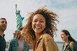 © Anne Schaum - Lifestyle portrait photography of a cheerful woman in her 30s that is smiling with friends in front of the Statue of Liberty in New York USA . Generative AI