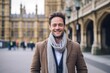 © Leon Waltz - Handsome young man wearing coat and scarf in London, UK