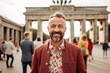 © Anne Schaum - Group portrait photography of a pleased man in his 40s that is wearing a chic cardigan in front of the Brandenburg Gate in Berlin Germany . Generative AI