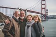 © Anne Schaum - Group portrait photography of a satisfied man in his 50s that is with the family at the Golden Gate Bridge in San Francisco USA . Generative AI