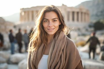 Portrait of a young woman in front of the Parthenon in Athens, Greece